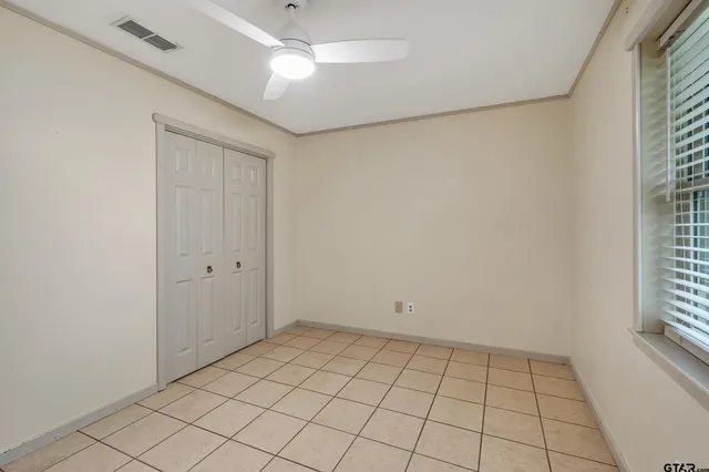 a view of an empty room and window