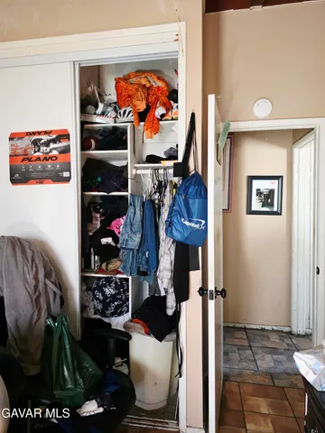 a room with furniture and a baby crib