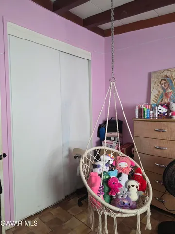 a bathroom with a sink a toilet a mirror and a shower