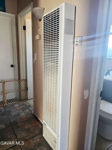 a view of a room with furniture and a window