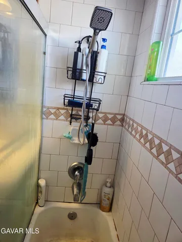 a bathroom with a sink and mirror