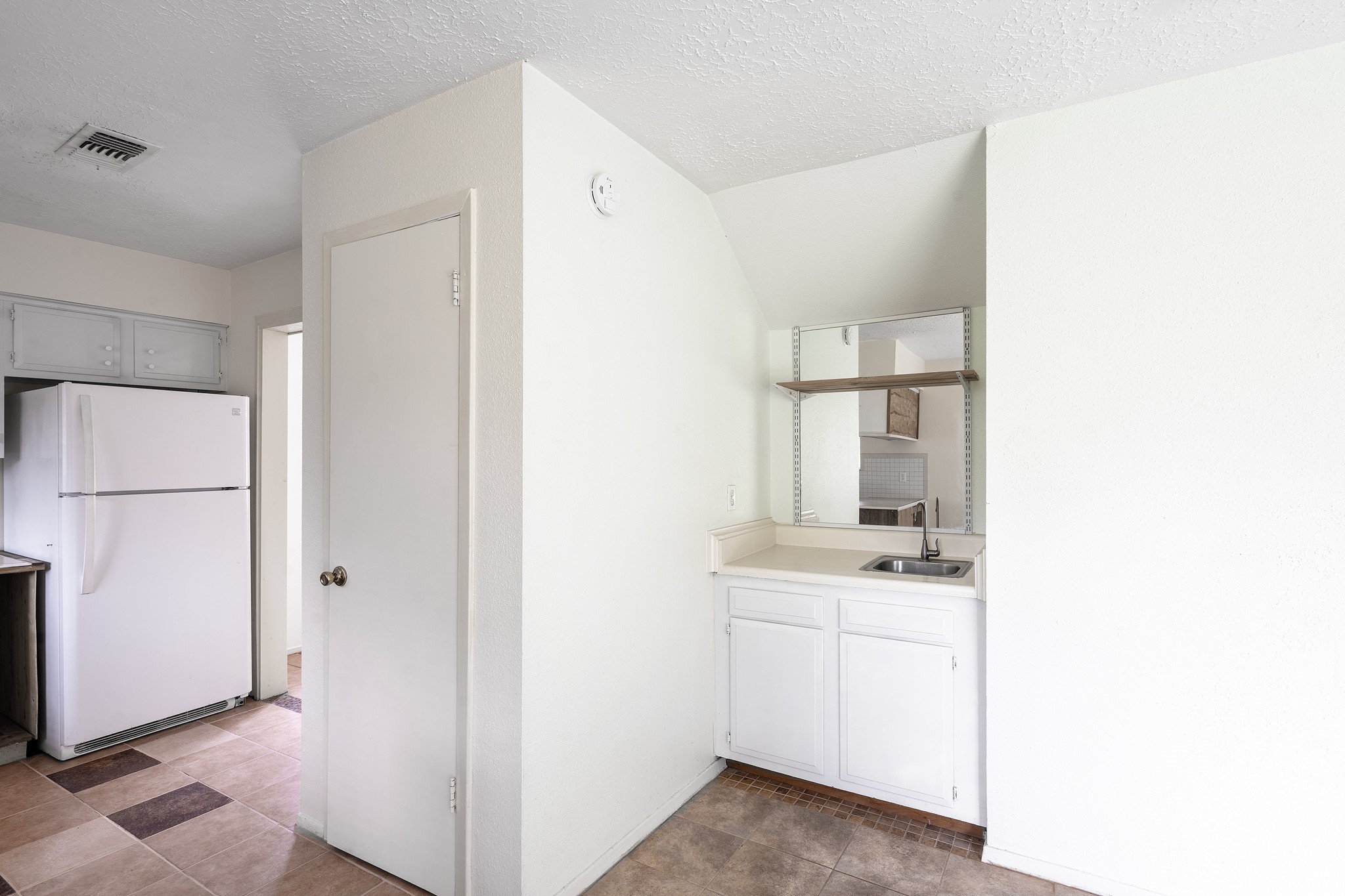 4423 Mossygate Drive Spring, TX 77373 - Photo 13 of 38 a view of kitchen with white cabinets