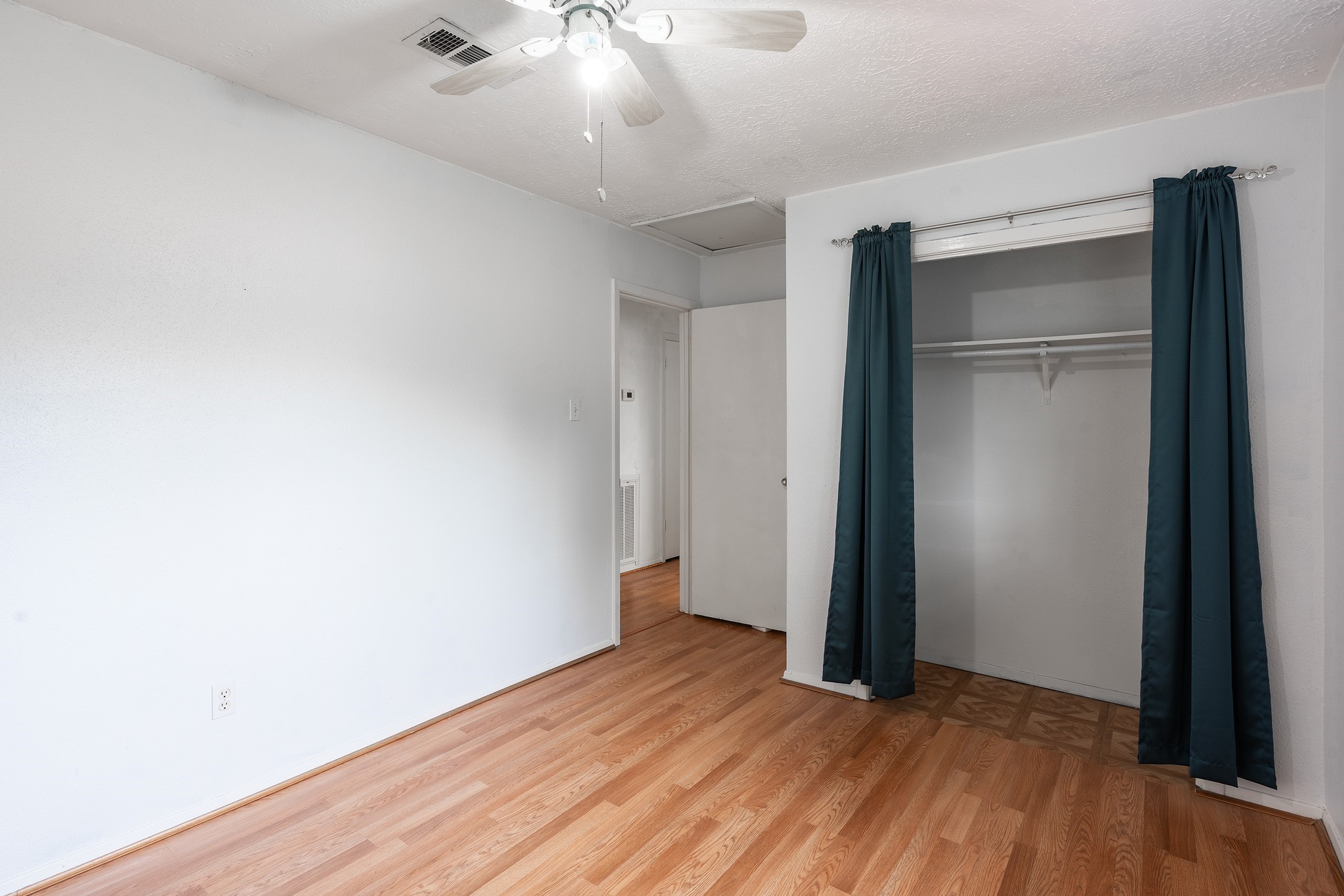 4423 Mossygate Drive Spring, TX 77373 - Photo 21 of 38 an empty room with wooden floor and closet