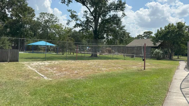 a swimming pool with outdoor seating and yard
