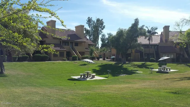 a bathroom with a shower and a toilet