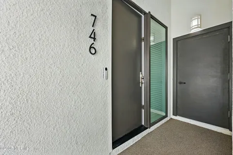 a bathroom with a shower and a glass door