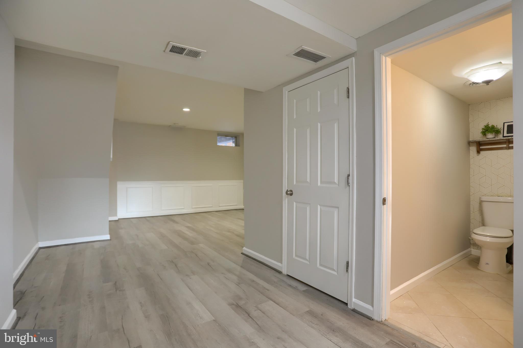 762 Seawall Road Baltimore, MD 21221 - Photo 23 of 35 Spacious, versatile basement with modern finishes.