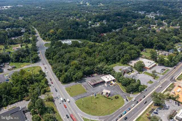 an aerial view of a house with outdoor space and street view