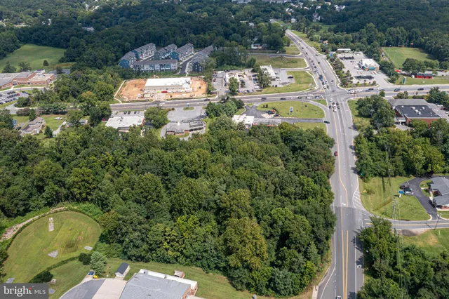 an aerial view of residential house with outdoor space and swimming pool
