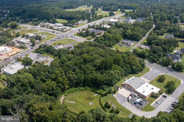 an aerial view of residential house with outdoor space and swimming pool