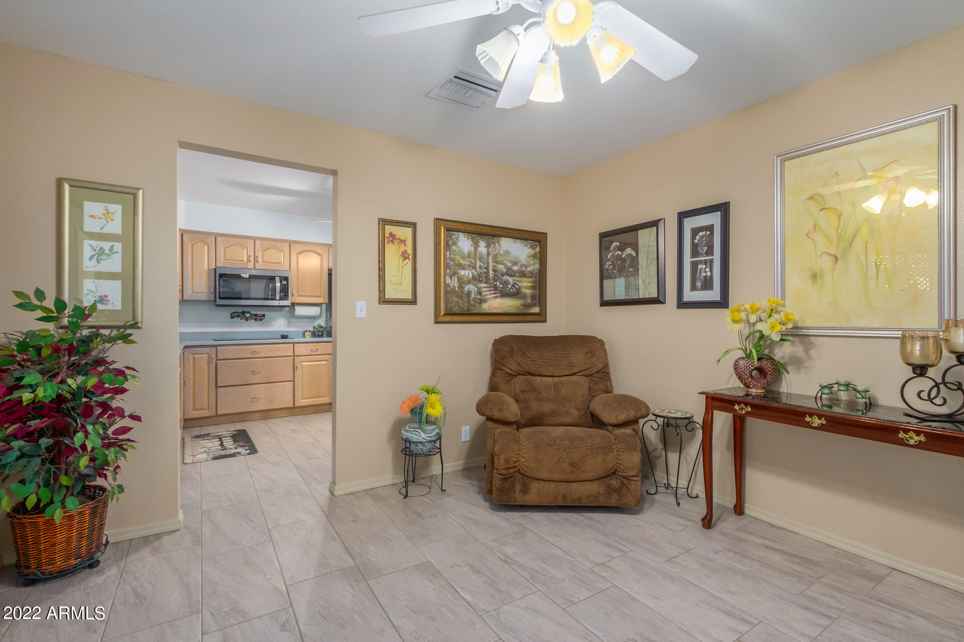 5853 East Adobe Road Mesa, AZ 85205 - Photo 11 of 26 a living room with furniture and flowers