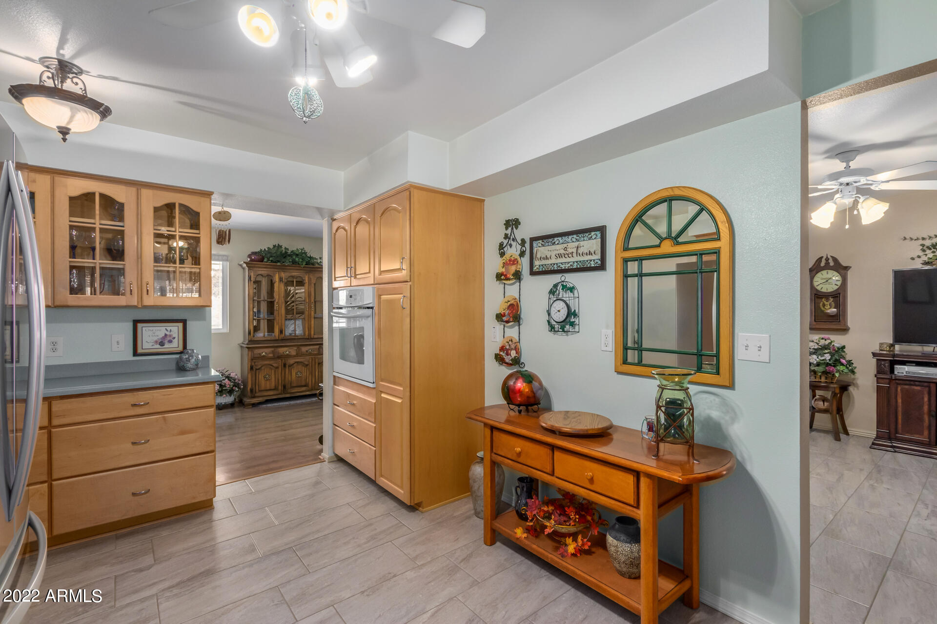 5853 East Adobe Road Mesa, AZ 85205 - Photo 15 of 26 a living room with furniture and a baby crib