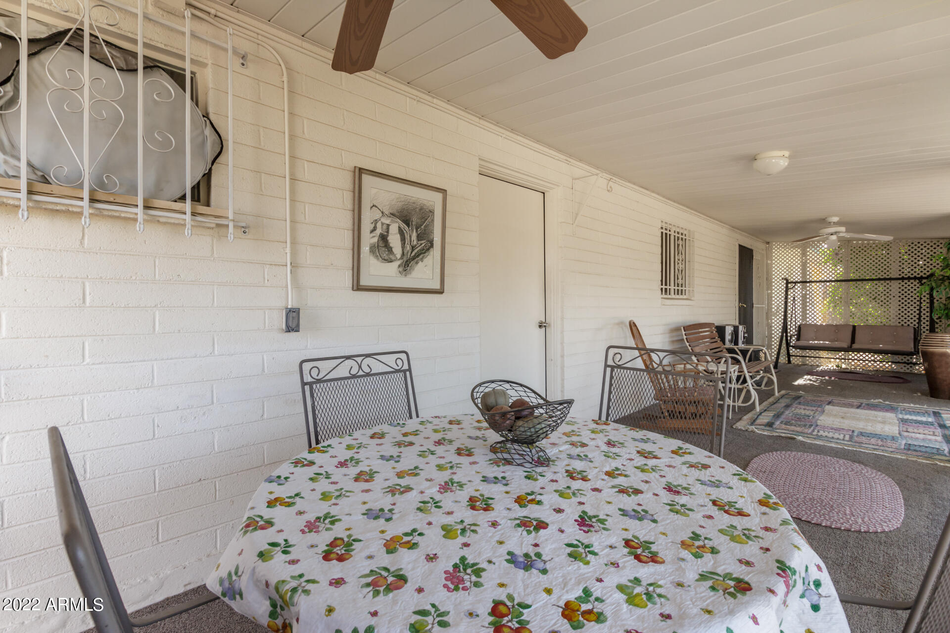5853 East Adobe Road Mesa, AZ 85205 - Photo 22 of 26 a bedroom with a bed and chair