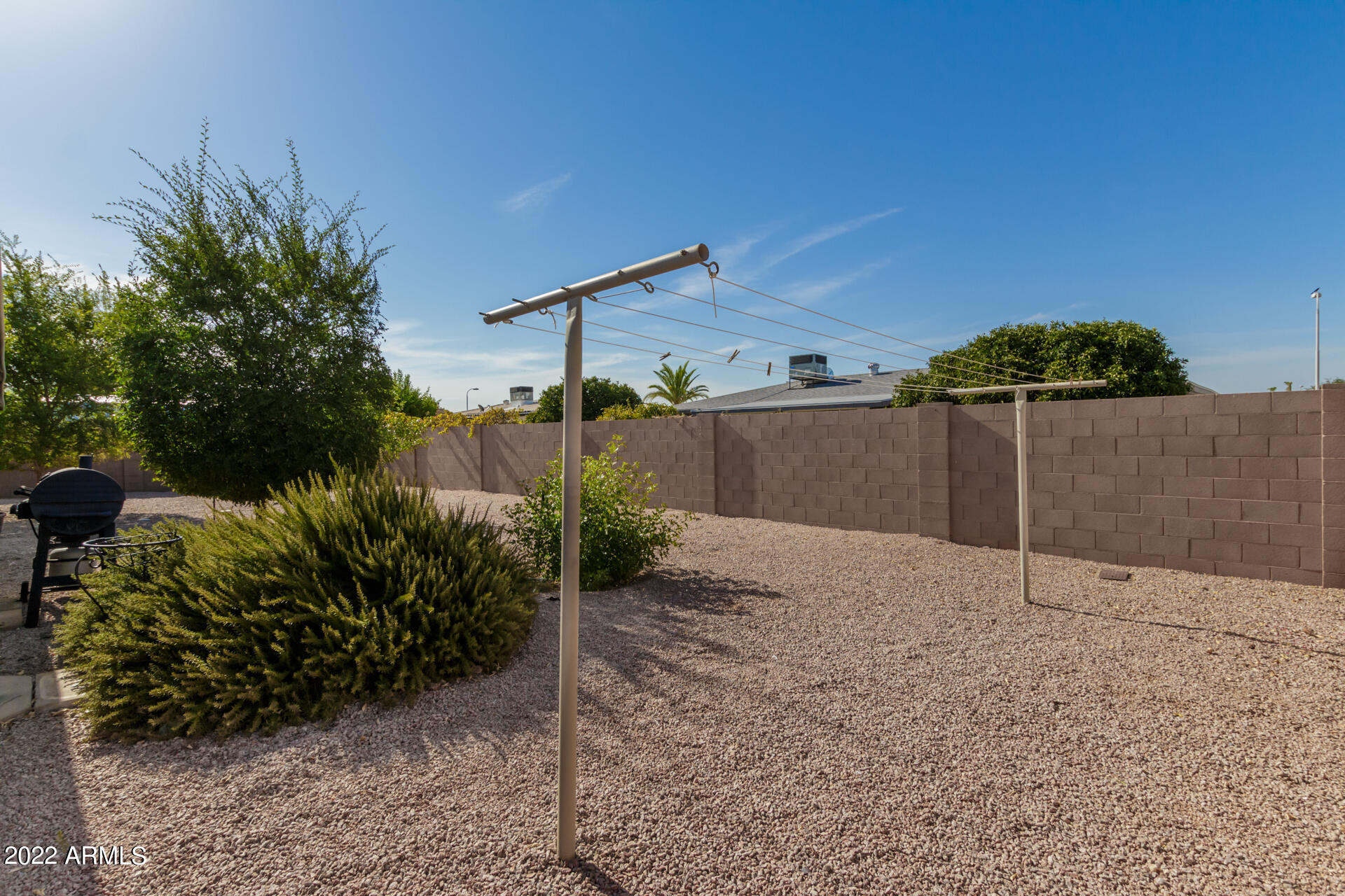 5853 East Adobe Road Mesa, AZ 85205 - Photo 26 of 26 a backyard of a house with a yard and garage