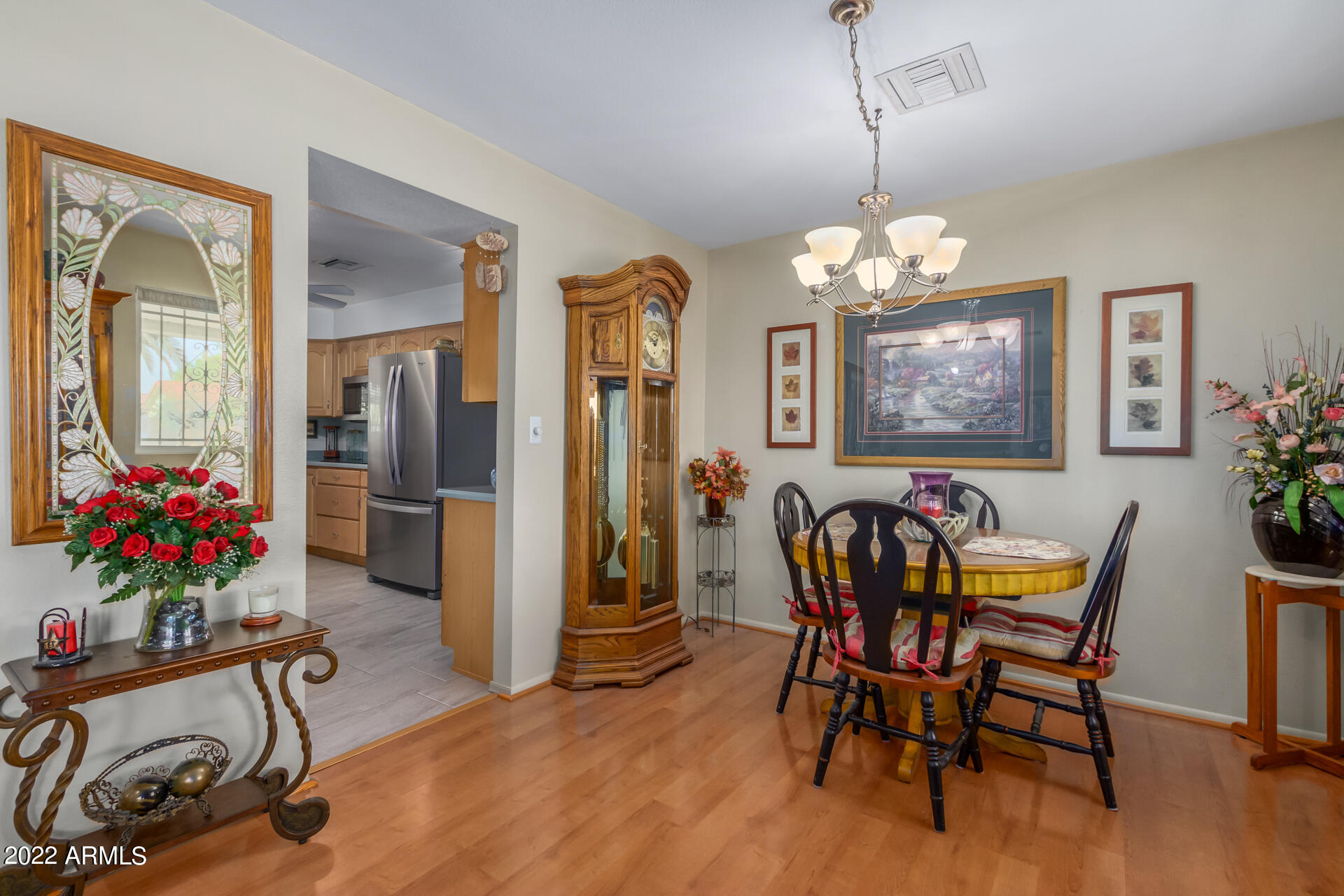 5853 East Adobe Road Mesa, AZ 85205 - Photo 9 of 26 a view of a dining room with furniture window and wooden floor