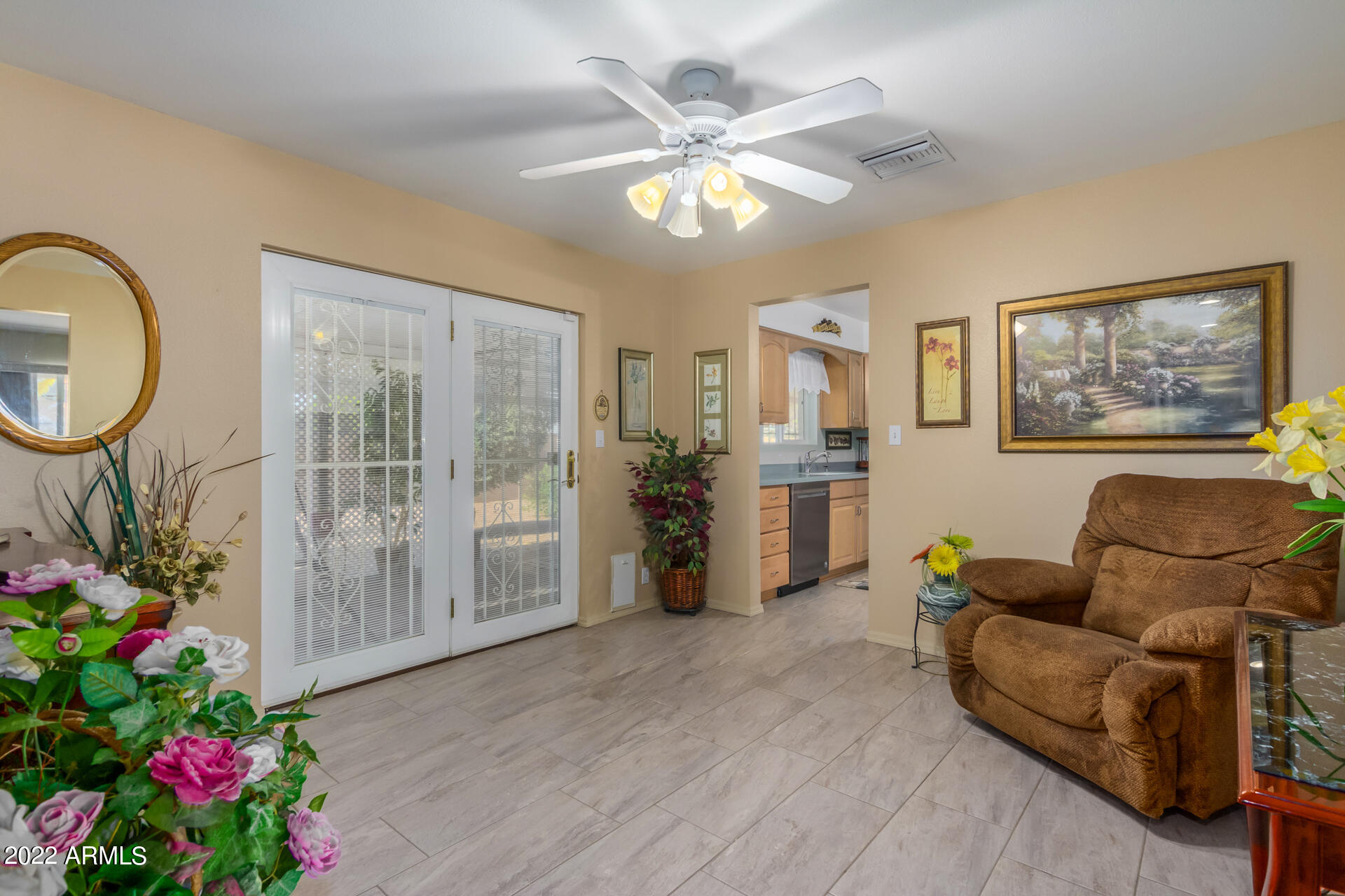 5853 East Adobe Road Mesa, AZ 85205 - Photo 10 of 26 a living room with furniture and flowers