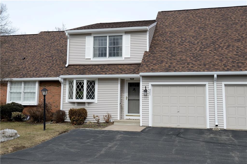 421 The Meadows, Unit 421 Enfield, CT 06082 - Photo 1 of 1 a front view of a house with a garage