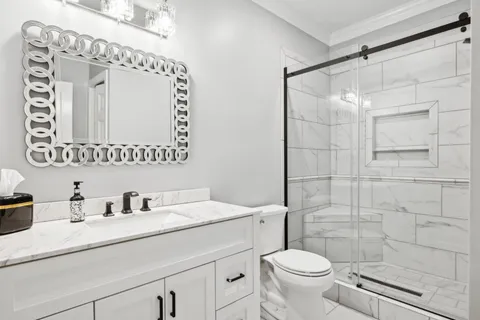 a kitchen with granite countertop a sink a counter top space appliances and cabinets