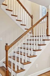 a bathroom with a shower sink and a mirror