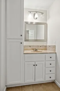 a view of a patio with table and chairs and potted plants