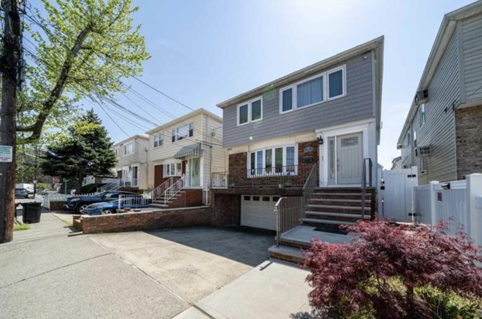 14 Centre Lane, Unit 2 Bayonne, NJ 07002 - Photo 21 of 21 a front view of a house with a garden
