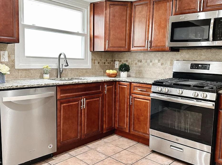 14 Centre Lane, Unit 2 Bayonne, NJ 07002 - Photo 8 of 21 a kitchen with granite countertop a stove and a sink