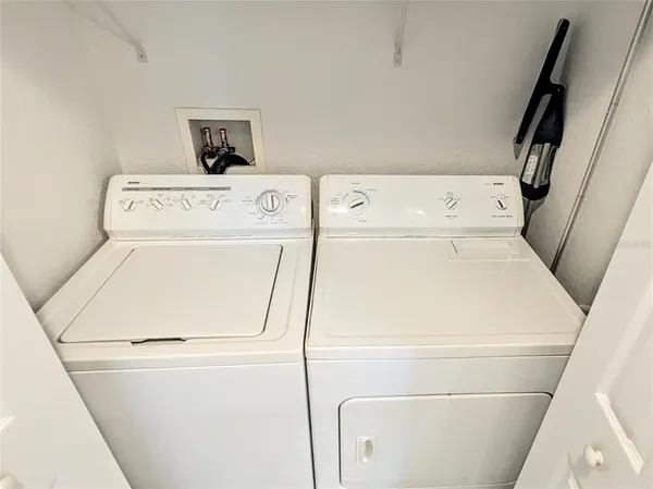 swimming pool view with a seating space