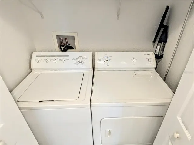 swimming pool view with a seating space