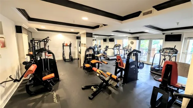 a room with furniture pool table and windows