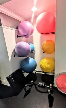 a living room with furniture a flat screen tv and a table