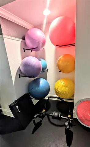 a living room with furniture a flat screen tv and a table