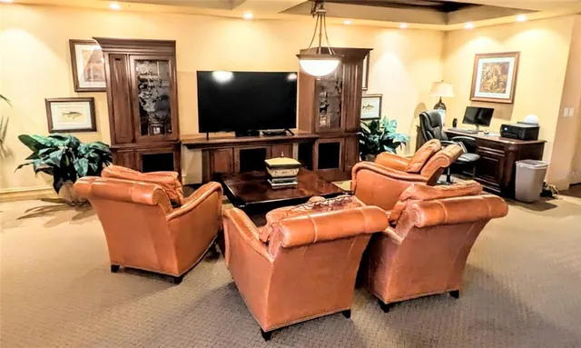 a view of swimming pool with outdoor seating