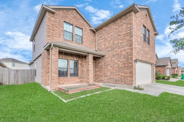 front view of a house with a yard