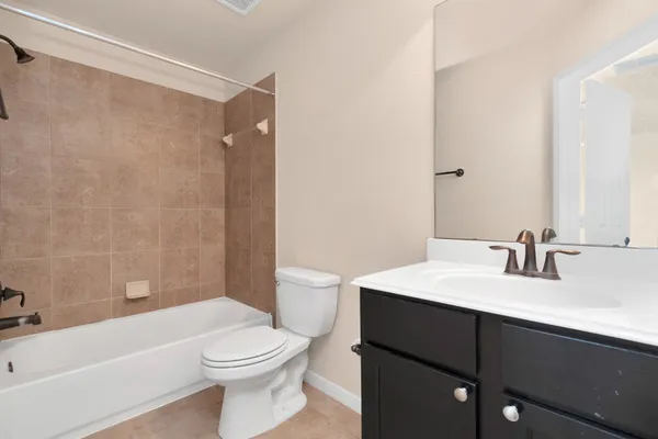 a bathroom with a sink a toilet and a bathtub