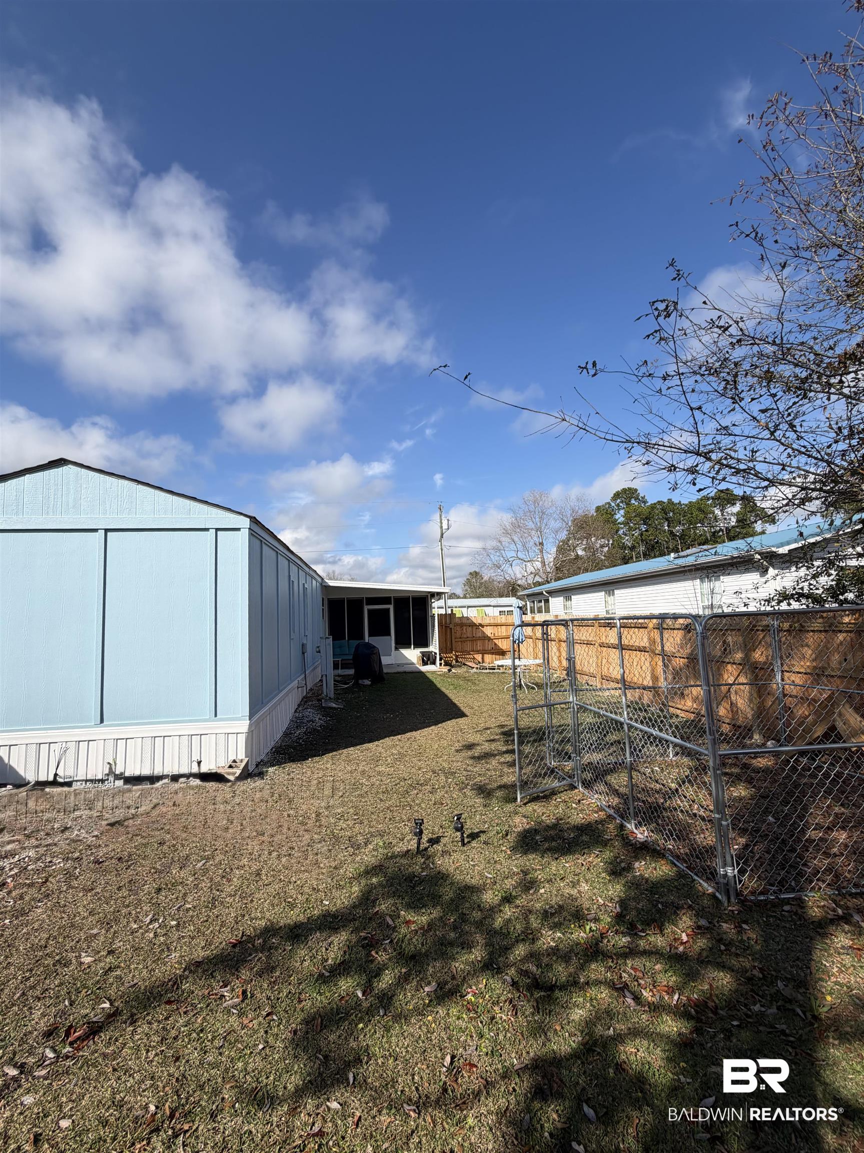 1913 Maria Lane Lillian, AL 36549 - Photo 14 of 35 View of yard with an outbuilding and a sunroom