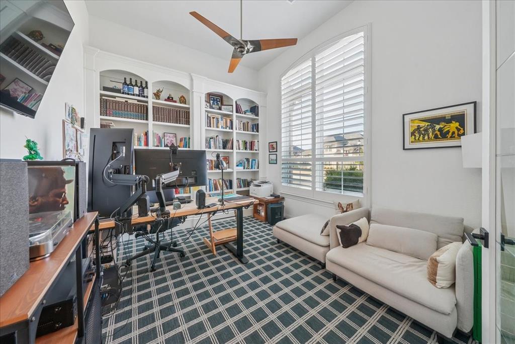 1981 Star Trace Parkway Prosper, TX 75078 - Photo 14 of 32 a living room with furniture a flat screen tv and a window