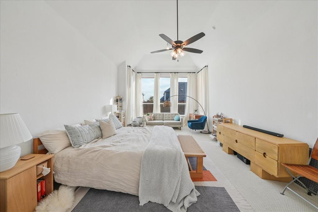 1981 Star Trace Parkway Prosper, TX 75078 - Photo 15 of 32 a bedroom with a bed and wooden floor
