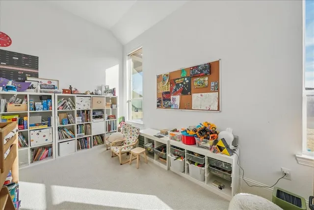a bedroom with furniture and a window