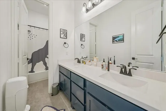 a bedroom with furniture and a chandelier