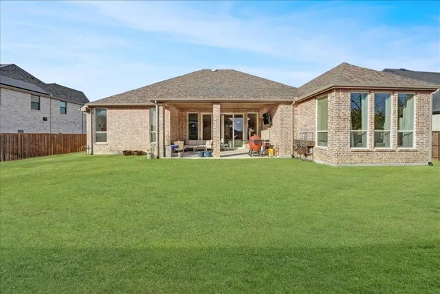 an aerial view of a house with a garden