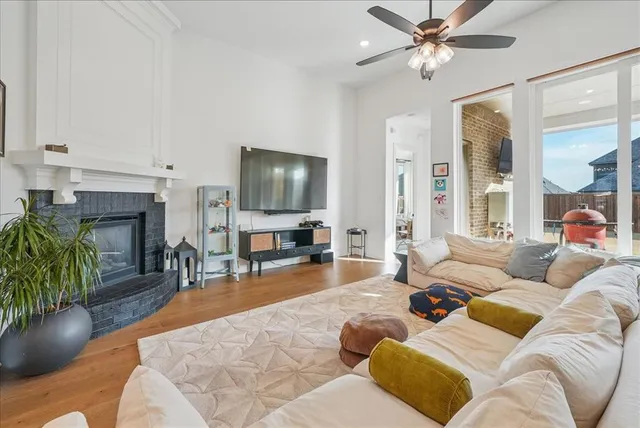 a kitchen with kitchen island granite countertop stainless steel appliances a sink stove and refrigerator