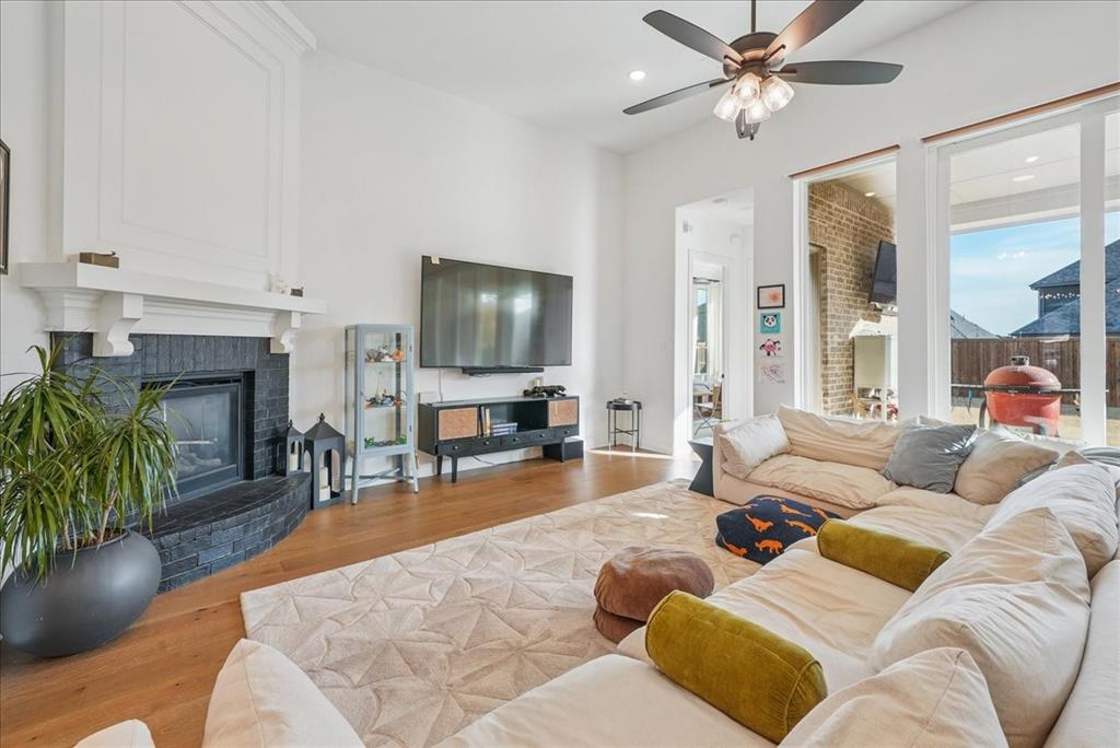 1981 Star Trace Parkway Prosper, TX 75078 - Photo 5 of 32 a living room with furniture and a flat screen tv