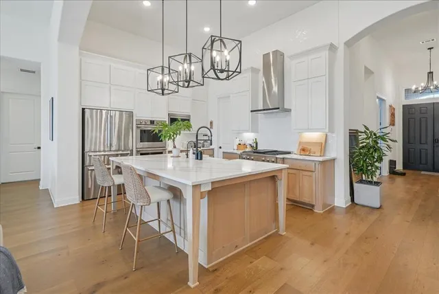 a kitchen with a table and chairs in it