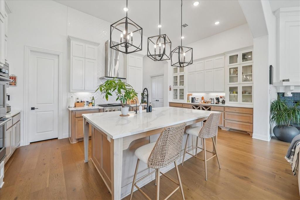 1981 Star Trace Parkway Prosper, TX 75078 - Photo 7 of 32 a kitchen with a table and chairs in it