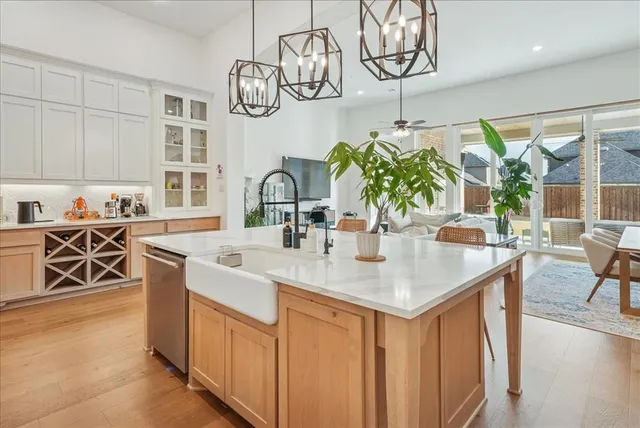 a kitchen with stainless steel appliances granite countertop a stove and a sink