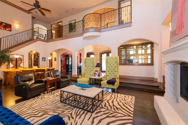 a living room with furniture fireplace and flat screen tv
