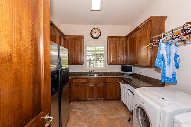 a view of a kitchen with a sink and cabinets