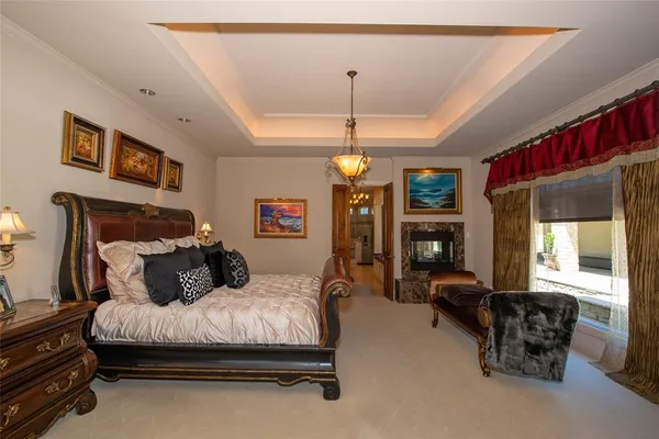 a bedroom with bed and window