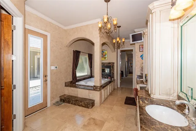 a bathroom with a sink a faucet a mirror and a bathtub