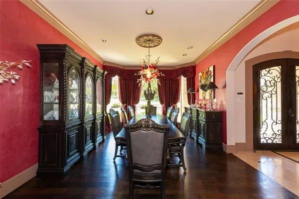 a living room with furniture fireplace and a large window